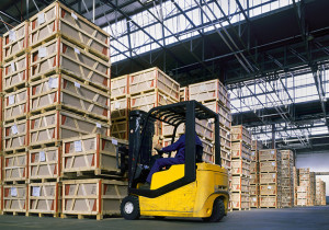 Forklift stacking wooden pallets